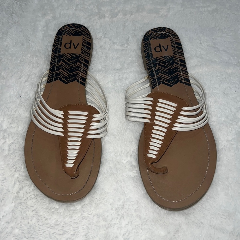 Lightly worn DV by Dolce Vita, white and brown, flat thong leather sandals